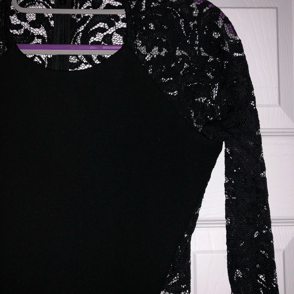 Form-fitted little black mini dress with lace